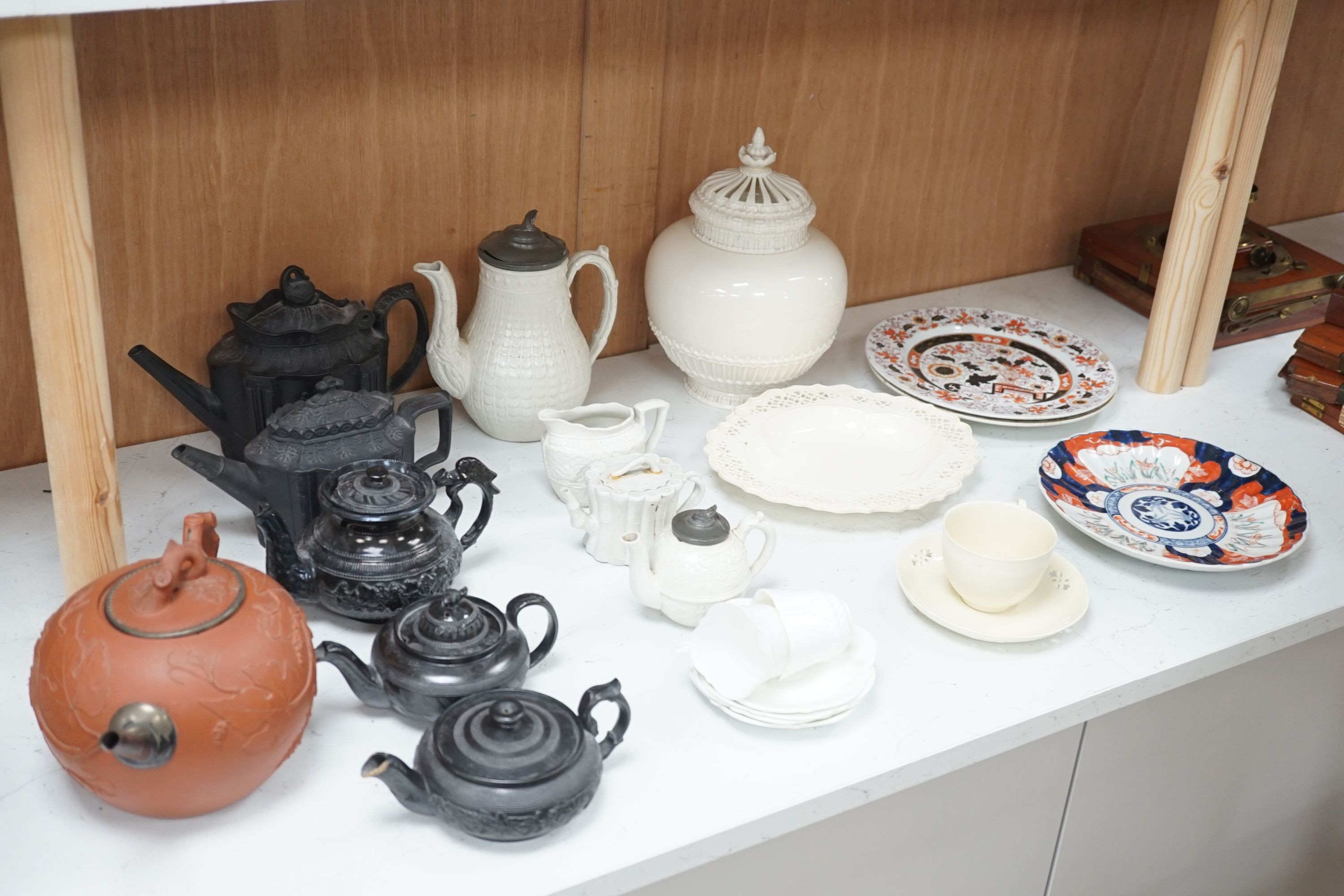 Four 19th century black basalt or black glazed pottery teapots, a large red ware teapot, a creamware dish and a Royal Worcester pot pourri, and other ceramics, tallest 27.5cm